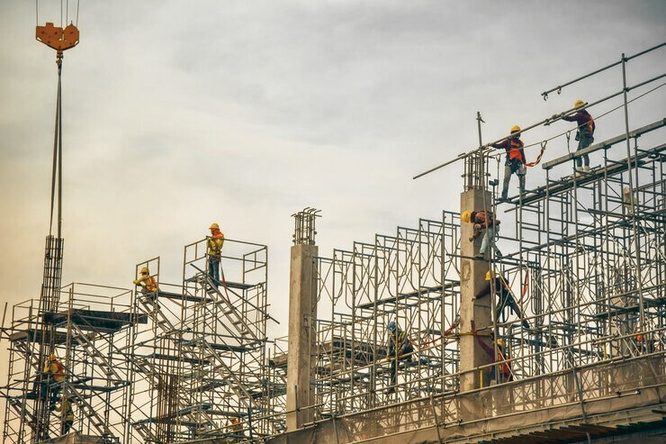 An RTL crew working on an erected scaffold deck